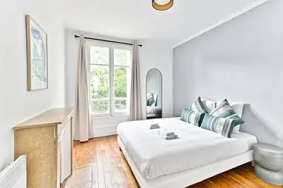 Un ou plusieurs lits dans un hébergement de l'établissement Appartement Vue panoramique sur la capitale - II