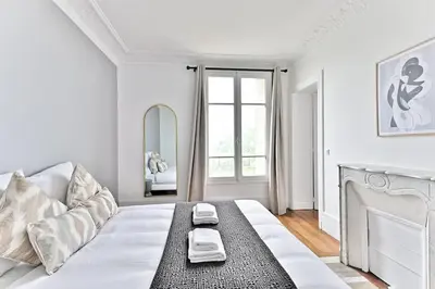 Un ou plusieurs lits dans un hébergement de l'établissement Appartement Vue panoramique sur la capitale - II