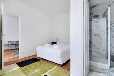Un ou plusieurs lits dans un hébergement de l'établissement Comfortable apt - 1BD - 4P - Montmartre