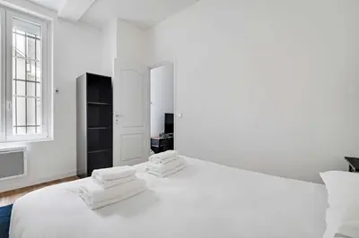 Un ou plusieurs lits dans un hébergement de l'établissement Comfortable apt - 1BD - 4P - Montmartre