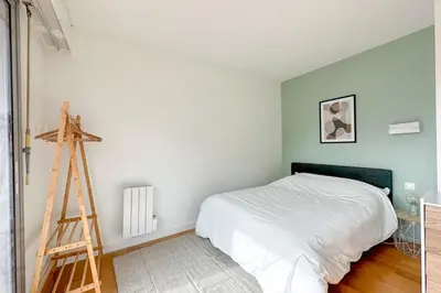 Un ou plusieurs lits dans un hébergement de l'établissement Flexliving - room - Ternes