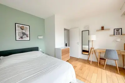 Un ou plusieurs lits dans un hébergement de l'établissement Flexliving - room - Ternes