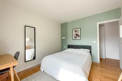 Un ou plusieurs lits dans un hébergement de l'établissement Flexliving - room - Ternes