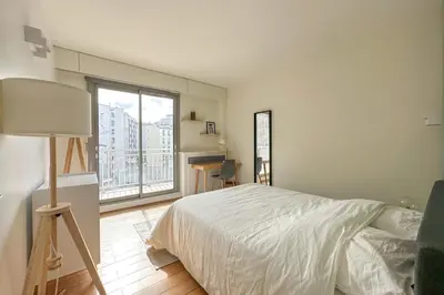 Un ou plusieurs lits dans un hébergement de l'établissement Flexliving - room - Ternes