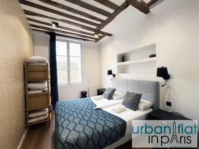 Un ou plusieurs lits dans un hébergement de l'établissement Urban Flat 108 - Classic Parisian 4 BDR Flat