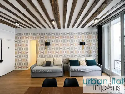 Coin salon dans l'établissement Urban Flat 108 - Classic Parisian 4 BDR Flat
