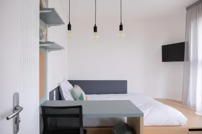 Télévision ou salle de divertissement dans l'établissement Résidence Kley Clichy