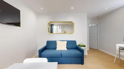Coin salon dans l'établissement Bluestay 196 - Charmant Appartement au Marais