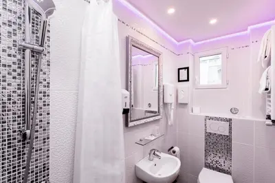 Salle de bains dans l'établissement Grand Hôtel Amelot