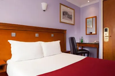 Un ou plusieurs lits dans un hébergement de l'établissement Grand Hôtel Amelot