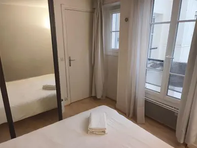 Un ou plusieurs lits dans un hébergement de l'établissement Chic Studio 30ms to Le Bon Marche N6-71