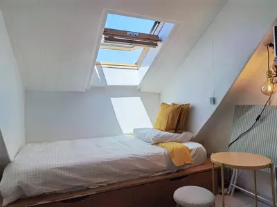 Un ou plusieurs lits dans un hébergement de l'établissement Top roof view studio with elevator 1mn St Germain