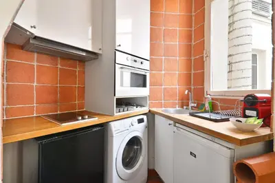 Cuisine ou kitchenette dans l'établissement Appartement Quartier Chatelet Les Halles 3 Free Netflix