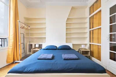 Un ou plusieurs lits dans un hébergement de l'établissement Appartement Quartier Chatelet Les Halles 3 Free Netflix