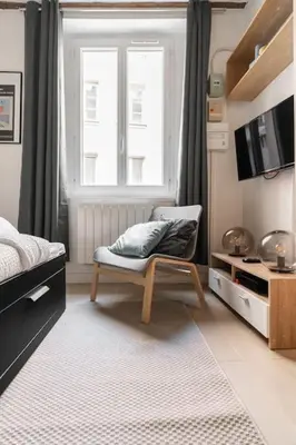 Un ou plusieurs lits dans un hébergement de l'établissement Studio en plein Coeur du Marais