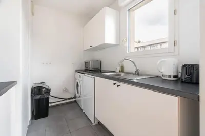 Cuisine ou kitchenette dans l'établissement Appartement Fonctionnel Immeuble Neuf