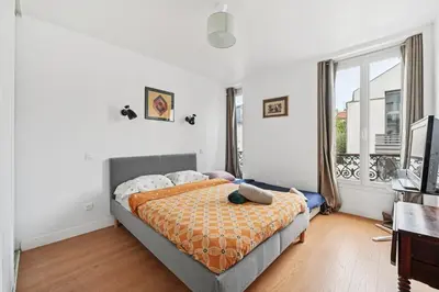 Un ou plusieurs lits dans un hébergement de l'établissement 5 persons apartment Montparnasse