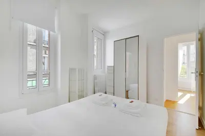 Un ou plusieurs lits dans un hébergement de l'établissement Comfortable flat near Paris - Suresnes