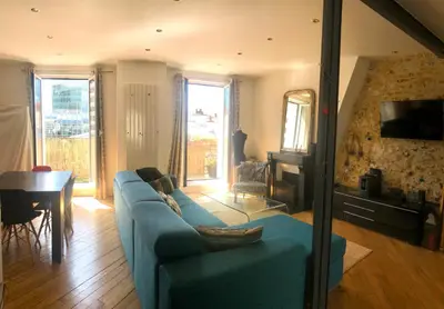 Télévision ou salle de divertissement dans l'établissement Duplex atypique proche Montparnasse & parc expositions