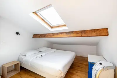 Un ou plusieurs lits dans un hébergement de l'établissement GuestReady - Séjour Idéal pour 4 Personnes