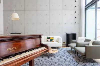 Coin salon dans l'établissement Parisian loft with plenty of light and solarium in Bastille area