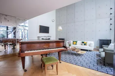 Coin salon dans l'établissement Parisian loft with plenty of light and solarium in Bastille area