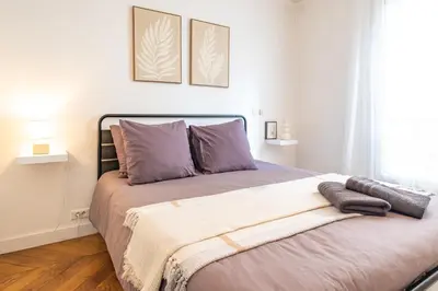 Un ou plusieurs lits dans un hébergement de l'établissement Spacious Apartment for 6 People