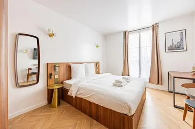 Un ou plusieurs lits dans un hébergement de l'établissement 152 Suite luxueuse-Etienne Marcel-Châtelet-Paris 3