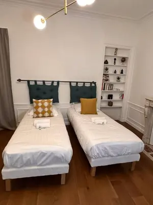 Un ou plusieurs lits dans un hébergement de l'établissement GuestReady - Spacieux Appartement idéal pour 6