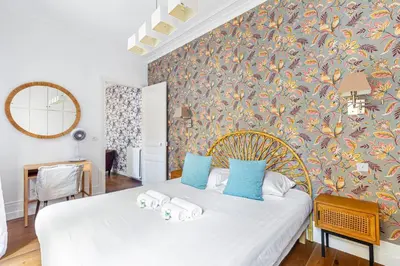 Un ou plusieurs lits dans un hébergement de l'établissement GuestReady - Spacieux Appartement idéal pour 6