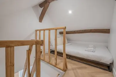 Un ou plusieurs lits dans un hébergement de l'établissement Appartement Mezzanine cœur du 11ème arrondissement
