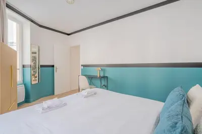 Un ou plusieurs lits dans un hébergement de l'établissement Appartement Mezzanine cœur du 11ème arrondissement