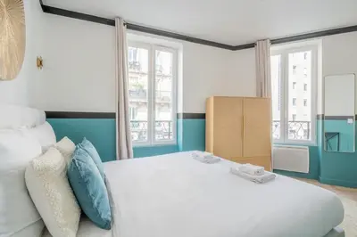 Un ou plusieurs lits dans un hébergement de l'établissement Appartement Mezzanine cœur du 11ème arrondissement
