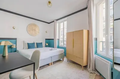 Un ou plusieurs lits dans un hébergement de l'établissement Appartement Mezzanine cœur du 11ème arrondissement