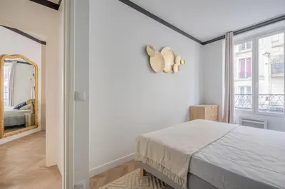 Un ou plusieurs lits dans un hébergement de l'établissement Appartement au cœur du 11ème Quartier Oberkampf