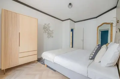 Un ou plusieurs lits dans un hébergement de l'établissement Appartement au cœur du 11ème Quartier Oberkampf