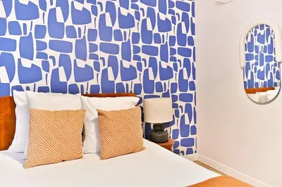 Un ou plusieurs lits dans un hébergement de l'établissement Appartement 3 chambres Paris 2ème - III