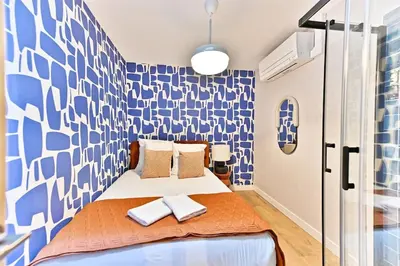 Un ou plusieurs lits dans un hébergement de l'établissement Appartement 3 chambres Paris 2ème - III