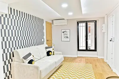 Coin salon dans l'établissement Appartement 3 chambres Paris 2ème - III