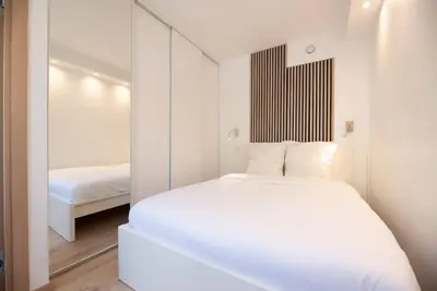 Un ou plusieurs lits dans un hébergement de l'établissement Appartement confortable et moderne - centre