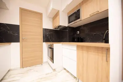 Cuisine ou kitchenette dans l'établissement Appartement confortable et moderne - centre