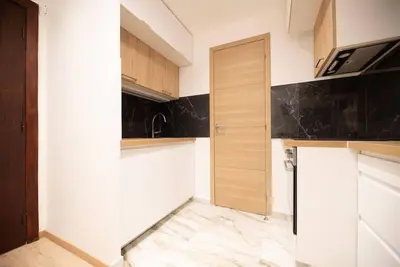 Cuisine ou kitchenette dans l'établissement Appartement confortable et moderne - centre
