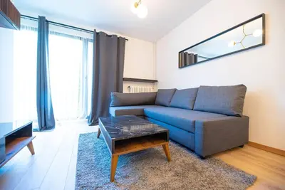 Coin salon dans l'établissement Appartement confortable et moderne - centre