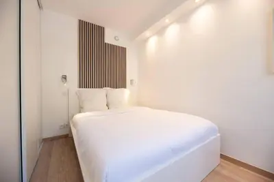 Un ou plusieurs lits dans un hébergement de l'établissement Appartement confortable et moderne - centre