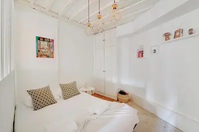 Un ou plusieurs lits dans un hébergement de l'établissement GuestReady - Appartement arty cosy et très central