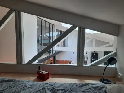 Un ou plusieurs lits dans un hébergement de l'établissement Loft 4-5 personnes à Montmartre - parking privé sur réservation