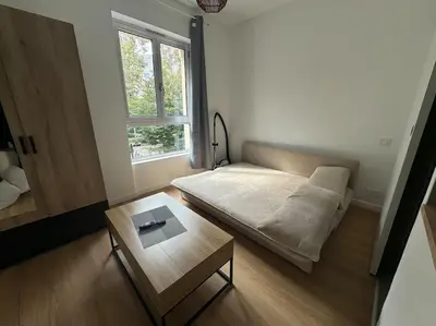 Un ou plusieurs lits dans un hébergement de l'établissement Agréable Studio palais des congrès Porte Maillot