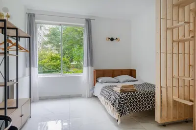 Un ou plusieurs lits dans un hébergement de l'établissement Modern apartment next Arc de Triomphe