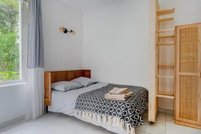 Un ou plusieurs lits dans un hébergement de l'établissement Modern apartment next Arc de Triomphe