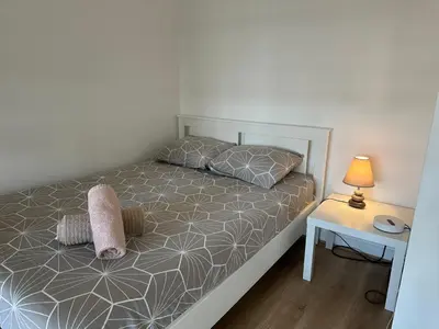 Un ou plusieurs lits dans un hébergement de l'établissement appartement magnifique et confortable